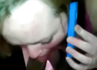 On the phone with her boyfriend with a dick in his mouth
